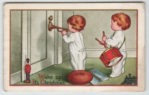 AK Vintage Weihnachten zwei Kinder spielen Instrumente am Weihnachtsmorgen - Bild 1 von 2