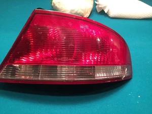 01-06 SEBRING RH PASSENGER 4 DOOR TAILLIGHT BRAKE TAIL LIGHT ID# 04805352AA - Picture 1 of 4