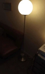 Floor lamp with a stainless steel base, 62” high and a round 12” lamp dome.  - Picture 1 of 1