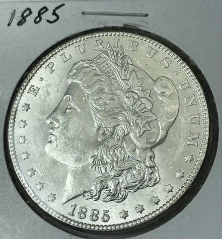 1885-P Morgan Silver Dollar in Choice AU Condition Blast White Cover