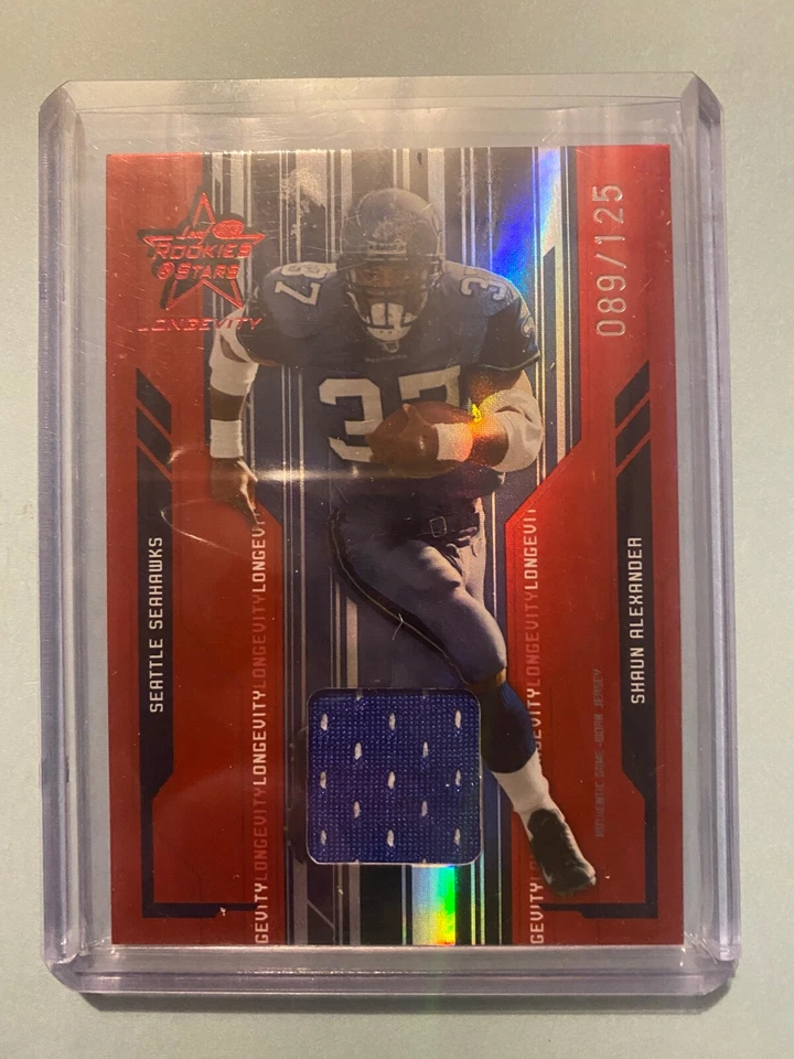 A32,321 - 2005 Leaf Rookies and Stars Longevity Jersey #85 Shaun Alexander/125 - Image 1 of 1