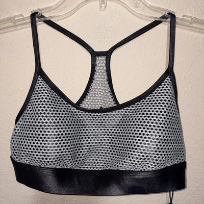 Nuevo con etiquetas Sujetador deportivo Koral negro brillante con tiras de malla plateada talla pequeña almohadillas extraíbles Foto 1 de 4
