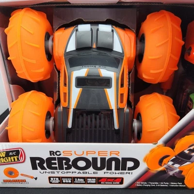 New Bright RC Super Rebound 1:16 Scale Orange 4x4 Radio Control Stunt Car Flips - Image 1 of 4