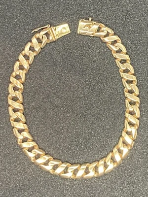 Bracelet gourmette massive en or jaune 18 carats 750 mixte signée joaillier - Photo 1/4