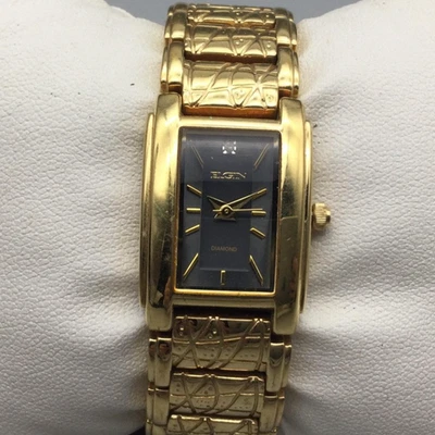 Reloj Elgin Diamante Mujer 19mm Tono Dorado Esfera Negra EG276T Batería Nueva 5.75" Foto 1 de 4