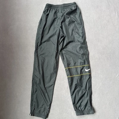 Pantalones deportivos Nike vintage para hombre XS verde naranja cortavientos años 90 tobillo cremallera holgados Foto 1 de 4