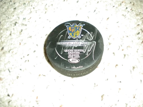 AHL GRAND RAPIDS GRIFFINS SIGNED AARON DOWNY GAME USED OFFICIAL  HOCKEY PUCK Cover