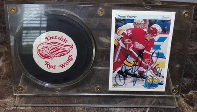 1990-91 Upper Deck Sergei Fedorov Autographed Young Guns RC w/ Red Wings Puck - Image 1 of 3