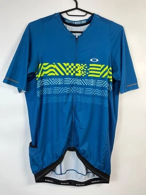 CAMISA JERSEY CICLISMO OAKLEY CORE FIT AZUL AMARILLO GRÁFICO CREMALLERA COMPLETA TALLA L Foto 1 de 4