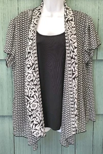 Blusa de granero de vestir negra blanca con volantes forrada con superposición floral sin mangas talla 18/20 - Imagen 1 de 7