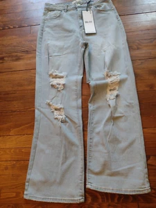 Neu mit Etikett Jeans hellblau abgenutzte Löcher 90er Passform Schlaghose weites Bein Festival Größe 9 - Bild 1 von 3