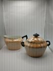 Royal Bavaria Lusterware Creamer And Sugar In Orange With Black Handle Accents.
