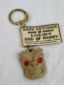 VTG Las Vegas Tropicana Sand Keychain Red Eyes Tiki God of Money Aztar Corp. Tag - Picture 1 of 3