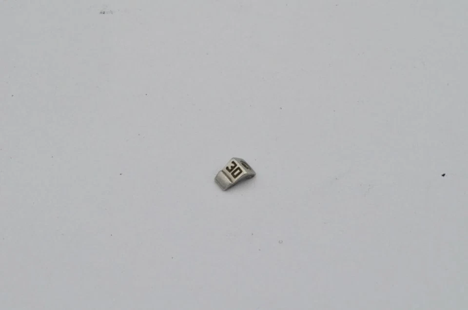 Breitling Chronomat Bezel Rider 30 Titanium 81950 Rider Tab with Screw - Image 1 of 1