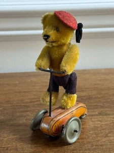 VINTAGE SCHUCO GERMANY FRICTION TOY MOHAIR BEAR ON SCOOTER W/ FELT HAT & PANTS - Picture 1 of 18