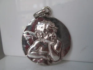 Medalla plata de ley. Querubín. Alto relieve. Colgante / argolla. Años 70 - Imagen 1 de 3