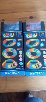 2 Coches de Pistas Variables - Camiones Azules y Rojos ¡Nuevos en Caja! Foto 1 de 4