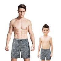father and son matching swim shorts next