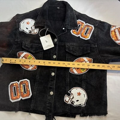 CHAQUETA DE PANA DE FÚTBOL AMERICANO CON LENTEJUELAS NEGRAS GRANDES DE LA NFL PARA MUJER Casco Bordes deshilachados NUEVA Foto 1 de 4