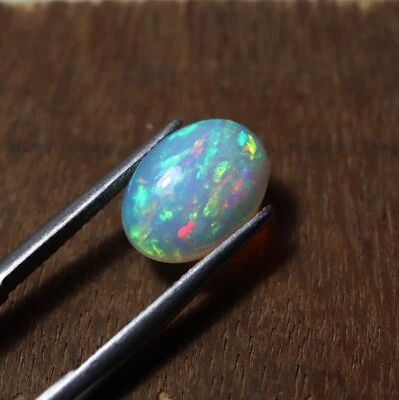 10x14 MM 3.8 Cts Natural AAA Grade Green Red Fire Ethiopian Opal Oval Cabochon - Image 1 of 4