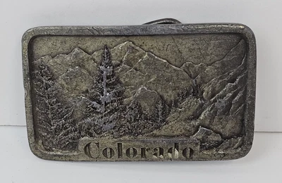 Hebilla de cinturón vintage 1978 Colorado Rockies Montañas Árboles Indiana Metal Craft Foto 1 de 4