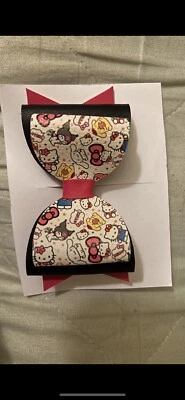 moño pelo hola gatito con sus amigos hecho con manos Foto 1 de 2