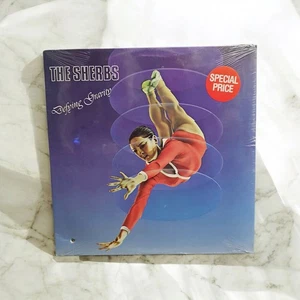 NEU VERSIEGELT THE SHERBS TROTZEN DER GRAVITY 1982 VERÖFFENTLICHUNG ATCO SD 38-146 VINYL LP - Bild 1 von 2