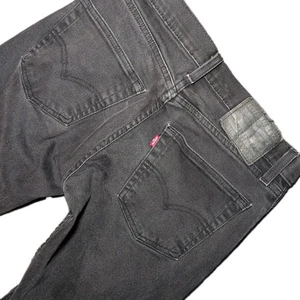 Pantalones de mezclilla ajustados rectos Levi's 511 para hombre 30x28 negros elásticos tiro medio cómodos - Imagen 1 de 10