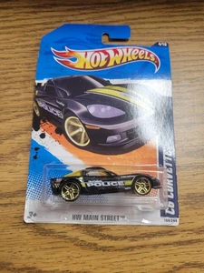 Hot Wheels 2011 HW Main Street 4/10 Scale Chevrolet 2004 C6 Corvette Black - Foto 1 di 4