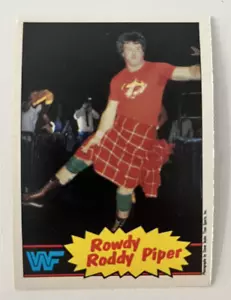 1985 O-Pee-Chee WWF Pro Wrestling Stars #7 Rowdy Roddy Piper Rookie - Foto 1 di 2