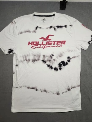 CAMISETA GRÁFICA HOLLISTER Hombre Mediana (Blanco/Negro; 100% Algodón)  Foto 1 de 4