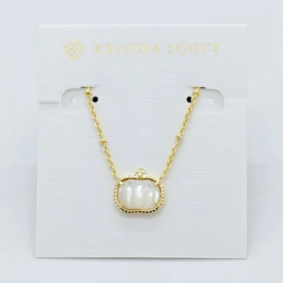 Nuevos aretes Kendra Scott de oro calabaza en concha de marfil Foto 1 de 4
