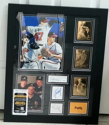 MADDUX GLAVINE  SMOLTZ AUTOGRAPHED AUTHENTIC Signed FRAMED BRAVES Photo JSA COA - Image 1 of 4