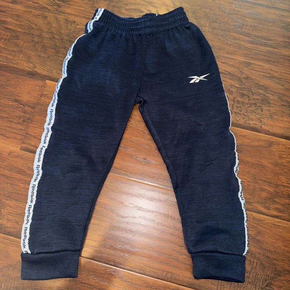 Kids Reebok Track Pants. Navy Blue. Size 5 Side Stripe Logo On Leg - Image 1 of 4