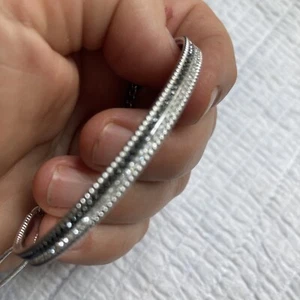 $129 SWAROVSKI LOLLYPOP BANGLE Bracelet Black/White Stones RHODIUM PLATED Sz M - Picture 1 of 11
