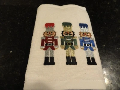 2 NWT white Hand towels~ NUTCRACKER SOLDIERS  16" x 26" HOLIDAY red green blue - Image 1 of 3