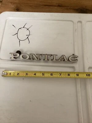 PONTIAC ASTRE GRILL EMBLEMA 1974-77 OEM 483628 com pinos - Imagem 1 de 2