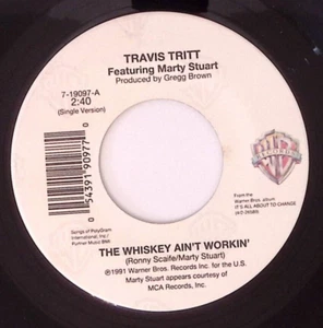 TRAVIS TRITT FT MARTY STUART THE WHISKEY AIN'T WORKIN'/BIBLE BELT VINYL 45 67-74 - Picture 1 of 3