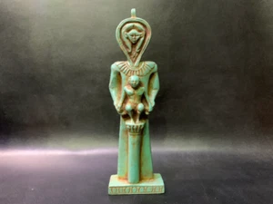 In a perfect scene HATHOR goddess standing as man and taking care of Horus - Imagen 1 de 2