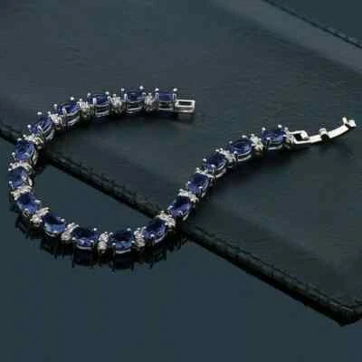 Brazalete de tenis para hombre de zafiro azul creado en laboratorio de corte ovalado de 9 quilates enchapado en oro blanco de 14 quilates Foto 1 de 4