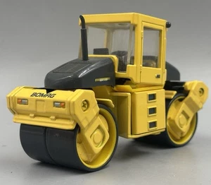 Bulldozer Bomag rodillo de vapor BW 184 AD obras modelo vehículo 1:50 amarillo - Imagen 1 de 9