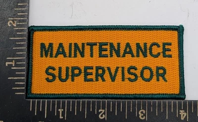 Parche de Supervisor de Mantenimiento - Dorado y Verde - Planchado - 4" x 1.75" Foto 1 de 2