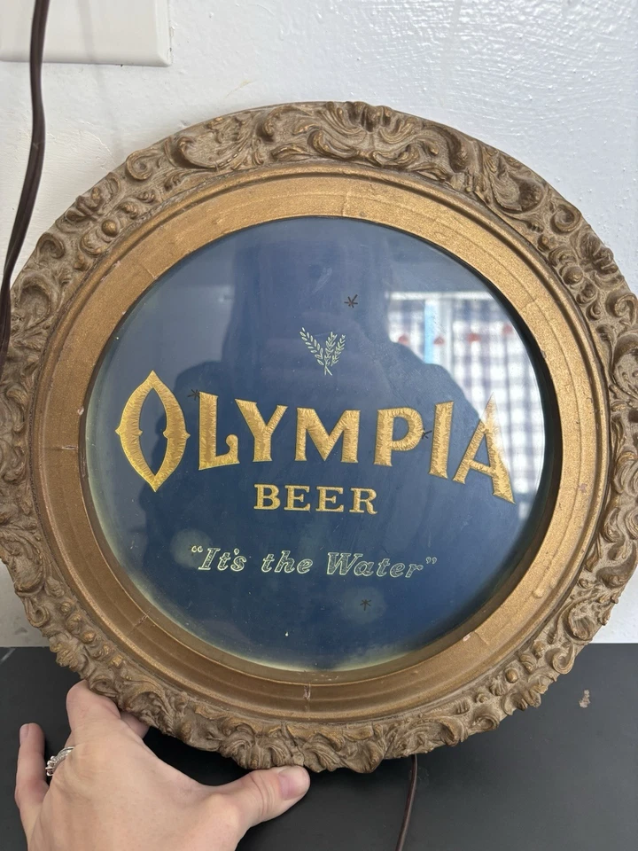 Letrero eléctrico vintage de estrellas centelleantes animadas de cerveza Olympia Foto 1 de 4