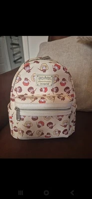 Loungefly Harry Potter Chibi Characters Wands Out All Over Print Mini Backpack - Image 1 of 4