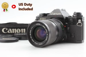 [N MINT con cinturino] Canon AE-1 Program fotocamera nera nuova FD 35-70mm f4 dal GIAPPONE - Foto 1 di 15