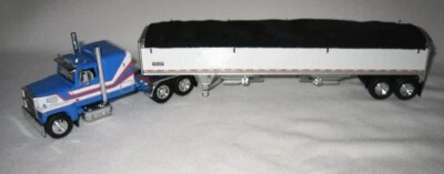 1/64 DCP 60-1942 Ford LTL-9000 60” Flatop (Blue) With Tandem Axle Grain Trailer - Image 1 of 3