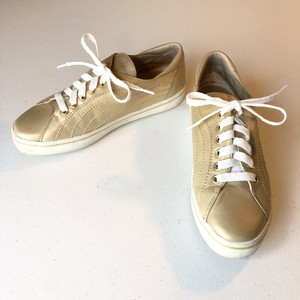 gold athletic shoes