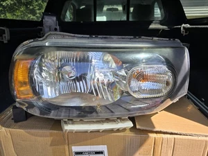 Faro pasajero Nissan Cube 2009-14 - Imagen 1 de 3