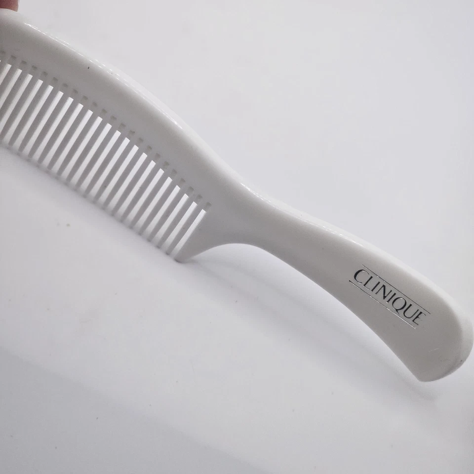 Peine desenredante de dientes anchos vintage de plástico duro blanco Clinique 7" Foto 1 de 3