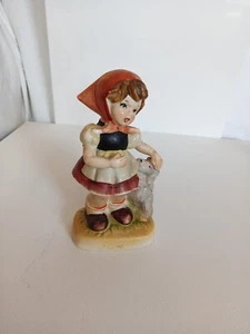 Estatuilla de porcelana pintada a mano Lefton de colección niña acariciando jugando con perro cachorro  - Imagen 1 de 8